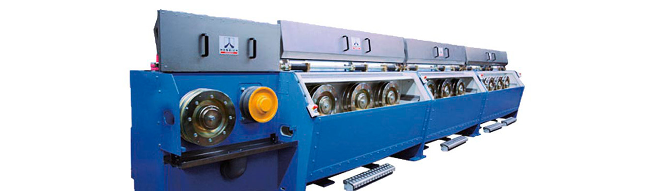 Henrich Walzdraht-Grobzugmaschine SHM mit Drahtziehkomponenten und Ziehrollen zur Reduzierung von Drahtdurchmesser in industrieller Fertigung.